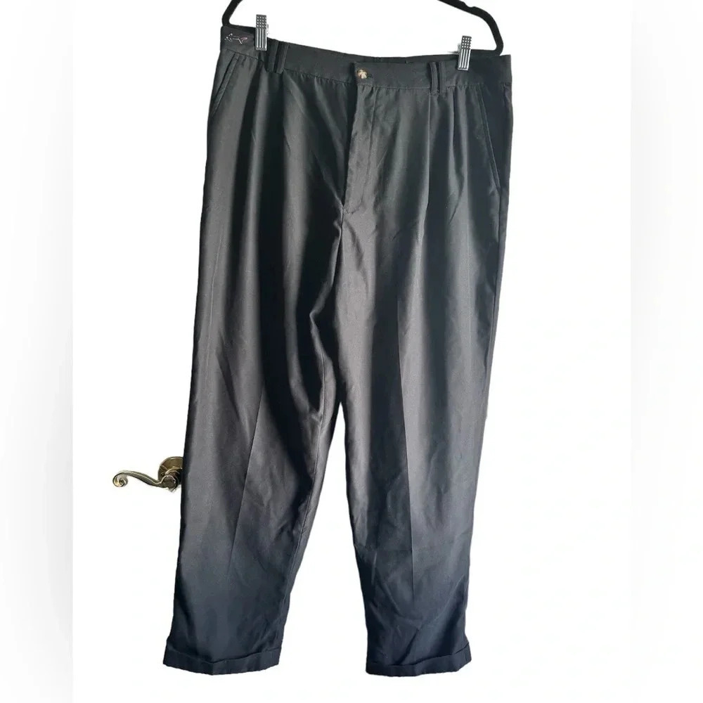 Greg Norman black, pleated golf slacks with a cuff.  Size 38x30
